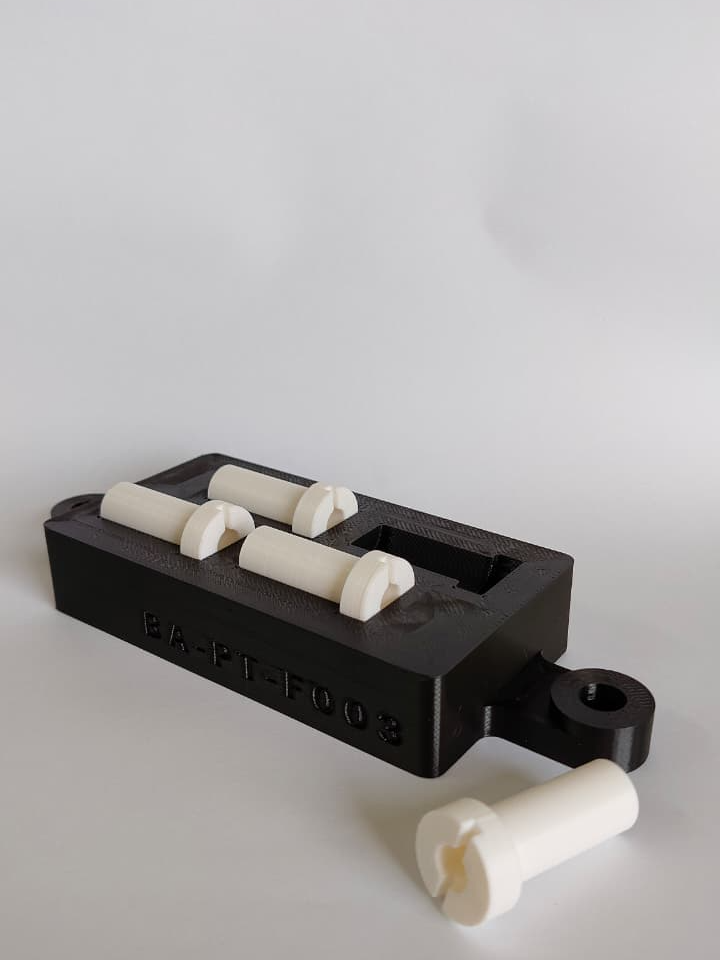 Custom laser marking fixture 3D printed in ABS holding cylindrical components